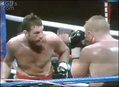 A boxer accidentally punches himself instead of his opponent.